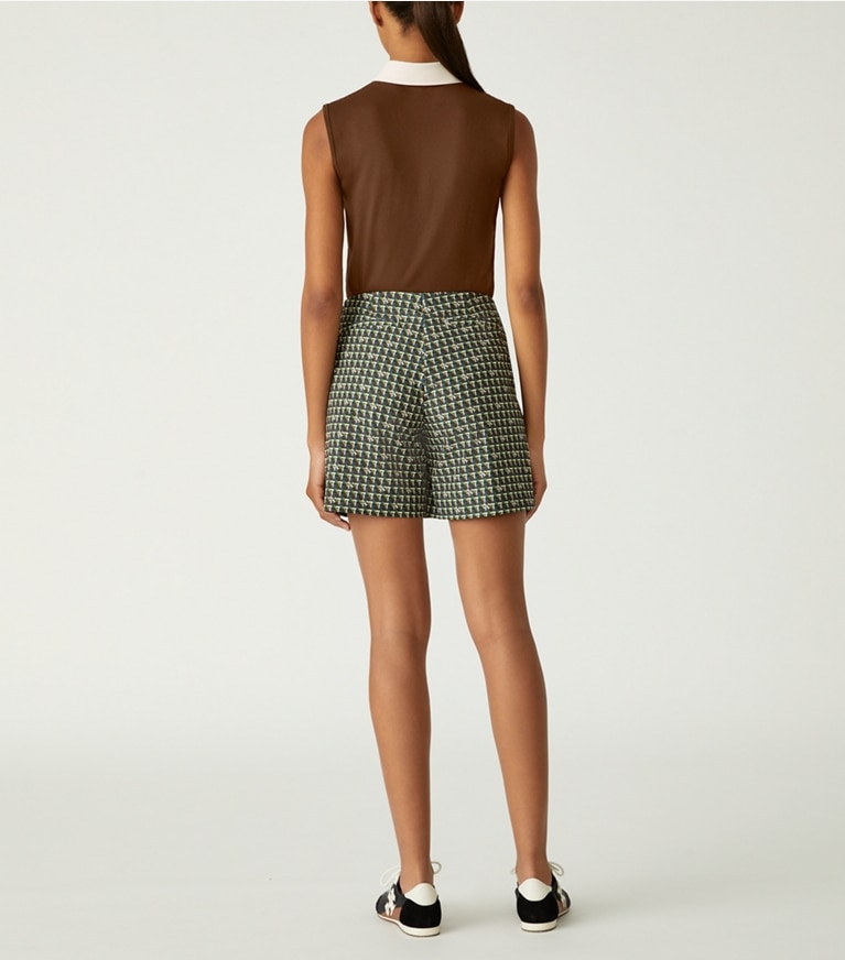 Tory Sport designer oberteile Ärmelloses Poloshirt aus Funktionspiqué in Colorblock-Optik in Dark Roast / NEW IVORY front