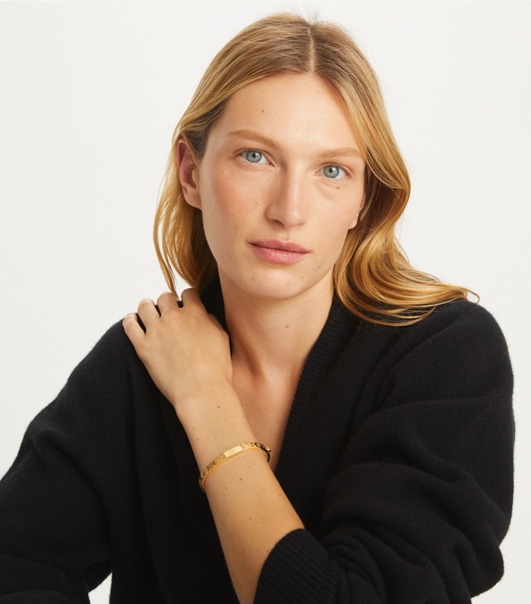 Tory Burch designer armbänder 5 mm Scharnierarmreif mit T-Monogramm in Tory Gold front