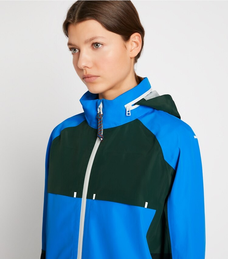 Tory Sport designer jackets All-Weather Colorblock Jacket in Vintage Blue / Conifer on model detail