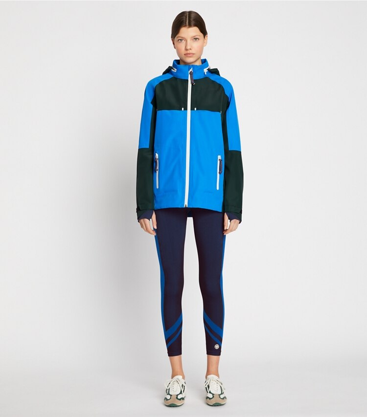 Tory Sport designer jackets All-Weather Colorblock Jacket in Vintage Blue / Conifer on model front