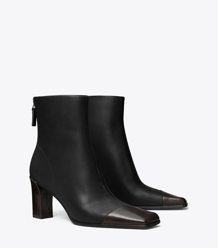 Tory Burch designer ankle boots Asymmetric Cap-Toe Ankle Boot in PERFECT BLACK / COCO angle