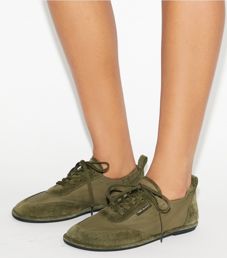 Tory Burch designer sneakers Ballet Sneaker in ARMY / ANETO accessory on model