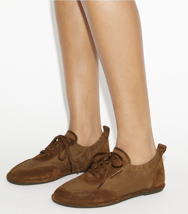 Tory Burch designer sneakers Ballet Sneaker in DRY MESA / COGNAC BROWN accessory on model