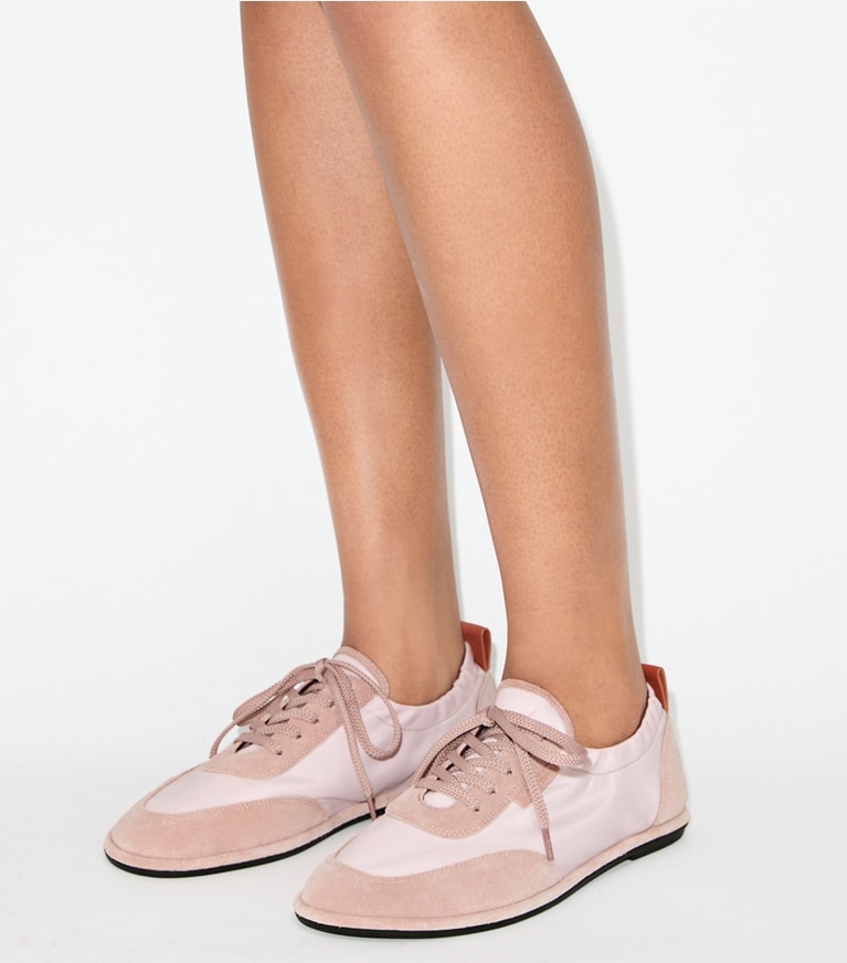 Tory Burch designer sneakers Ballet Sneaker in ROSE MIST / ROSE MIST accessory on model