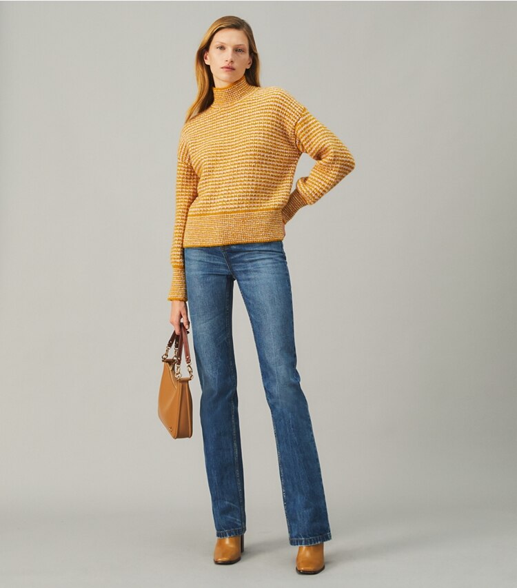 Tory Burch designer sweaters Balloon Sleeve Turtleneck Sweater in Gold Sun on model front