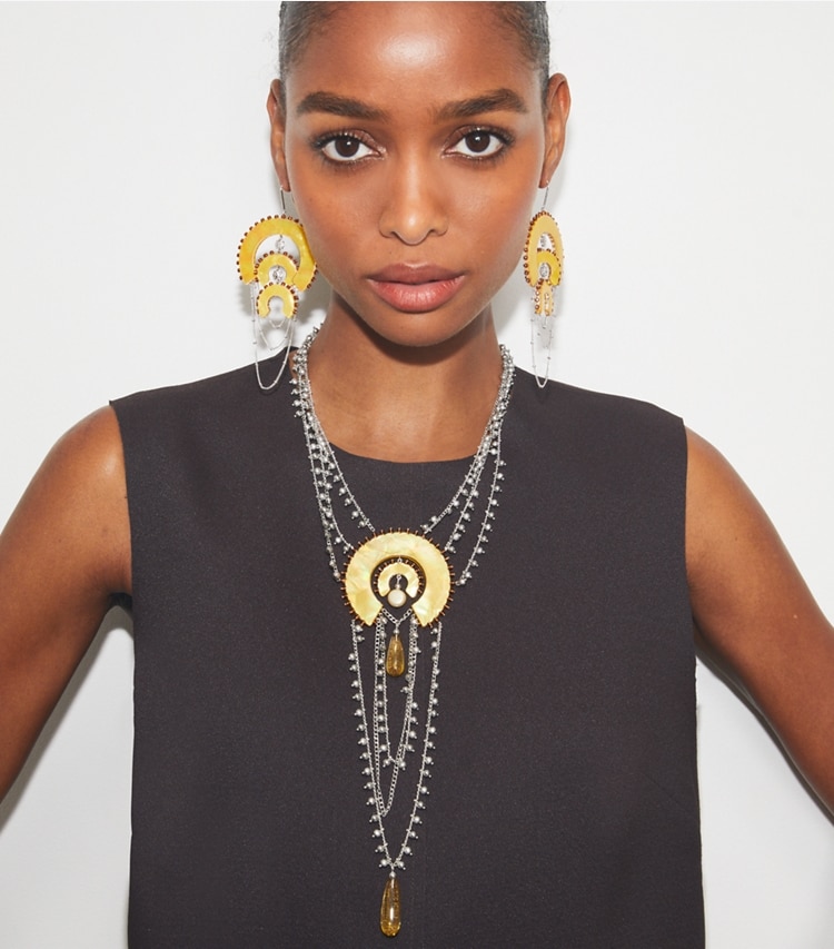 Tory Burch designer earrings Bead And Resin Chandelier Earrings in Antique Light Silver / Yellow accessory on model