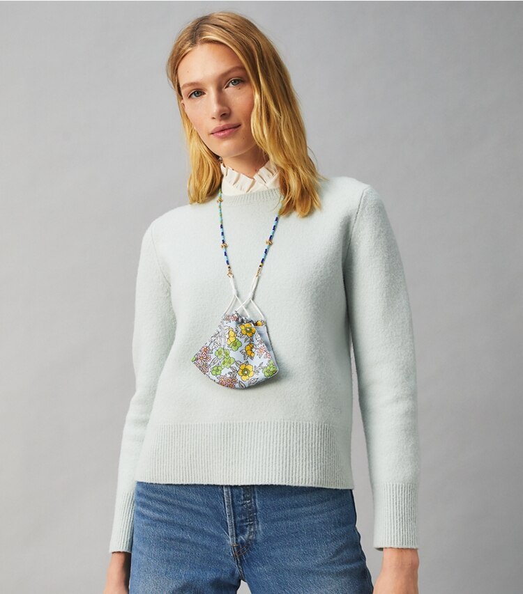 Tory Burch designer necklaces Beaded Face Mask Chain in Rolled Brass / Black accessory on model