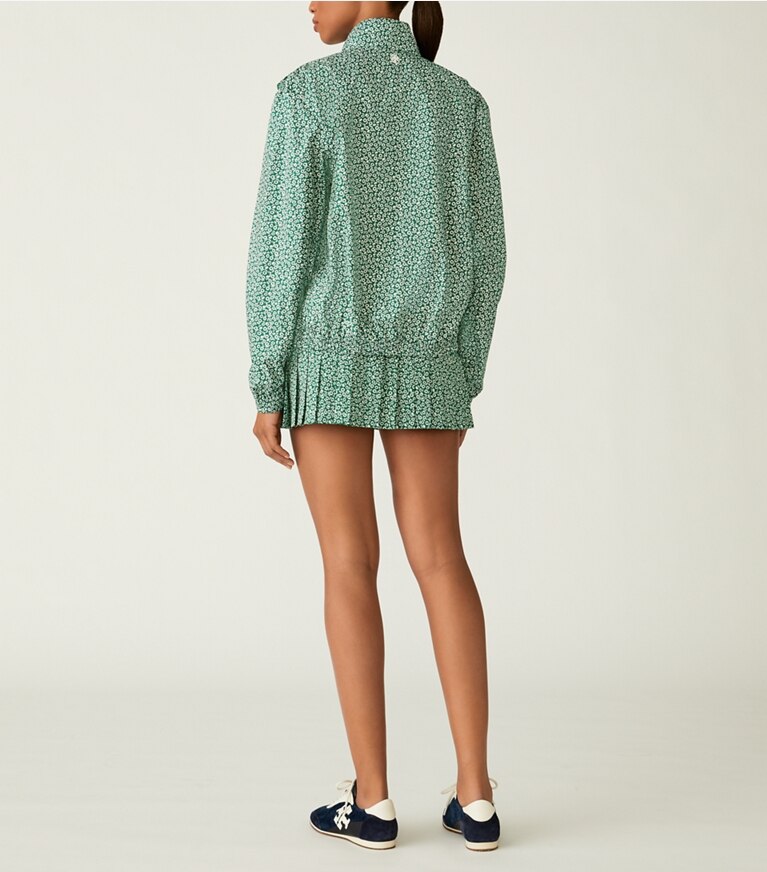 Tory Sport designer unterteile Bedruckter Tennisrock mit Faltensaum in Evergreen Ditsy Daisy front