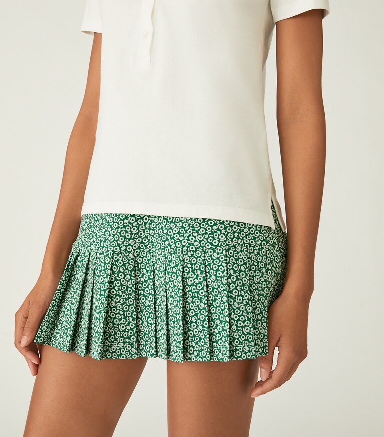 Tory Sport designer unterteile Bedruckter Tennisrock mit Faltensaum in Evergreen Ditsy Daisy front