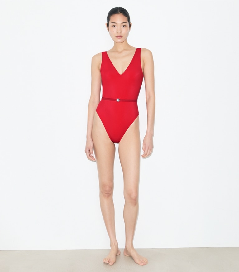 Tory Burch designer one pieces Belted Swimsuit in Bright Red on model front
