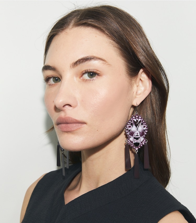 Tory Burch designer earrings Bird Earrings in Tory Silver / Purple accessory on model