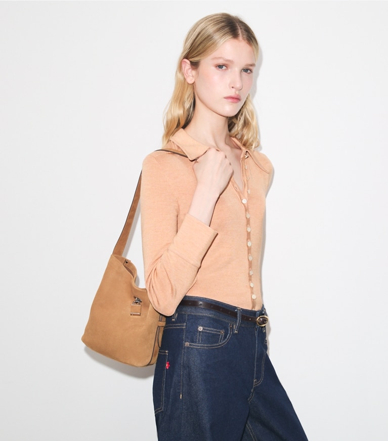 Tory Burch diseñador bolsos de hombro Bolso bucket fino mediano de gamuza con broche en Toffee accesorio en modelo