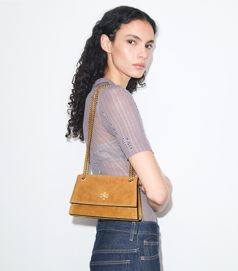Tory Burch diseñador bolsos de hombro Bolso de hombro Mini Kira de gamuza con broche giratorio en Toffee accesorio en modelo