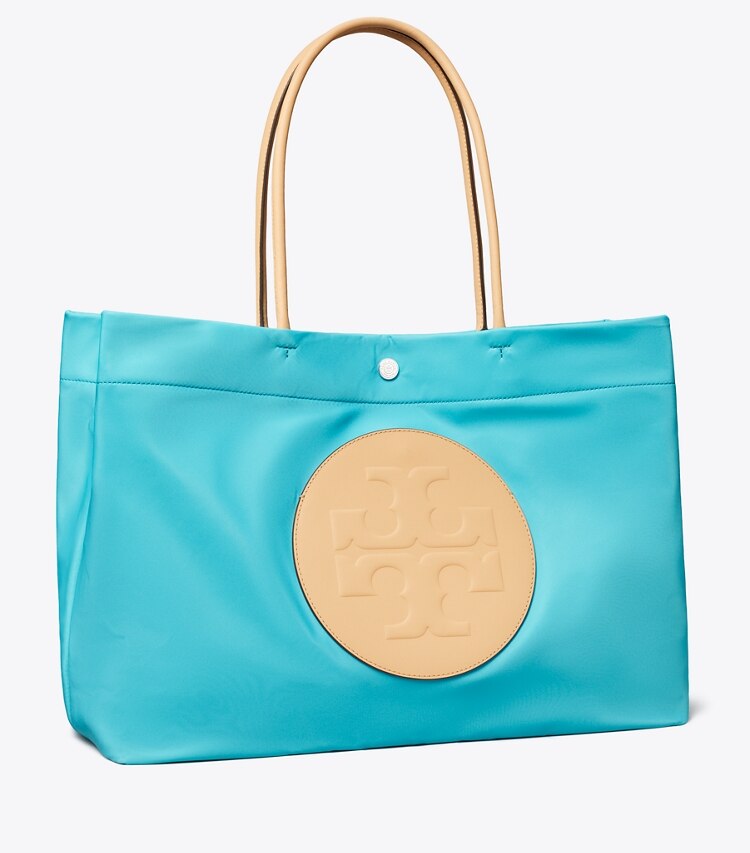 Tory Burch diseñador bolsos tote Bolso Tote reversible Ella Twist en Soft Turquoise ángulo
