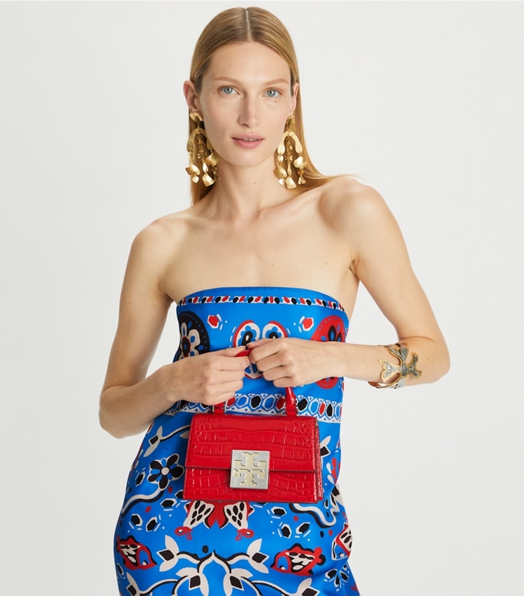 Tory Burch designer crossbody bags Bon Bon Croc Embossed Mini Top-Handle Bag in Candy Apple accessory on model