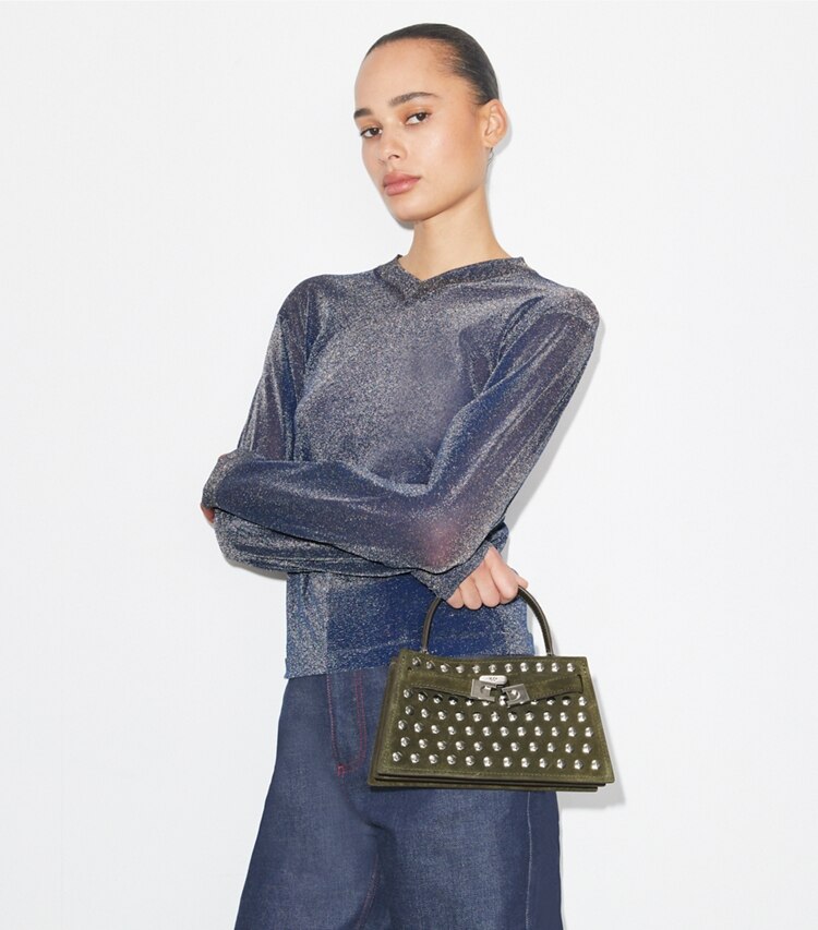 Tory Burch designer mini bags Borsa Mini Lee Radziwill in suede con borchie e manico superiore in Dark Olive additional on model