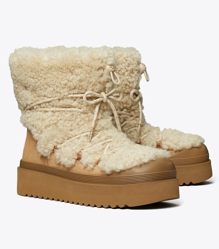 Tory Burch diseñador botas Bota Mellow de borreguillo con cordones en BUTTERMILK / LIGHT CHESTNUT ángulo