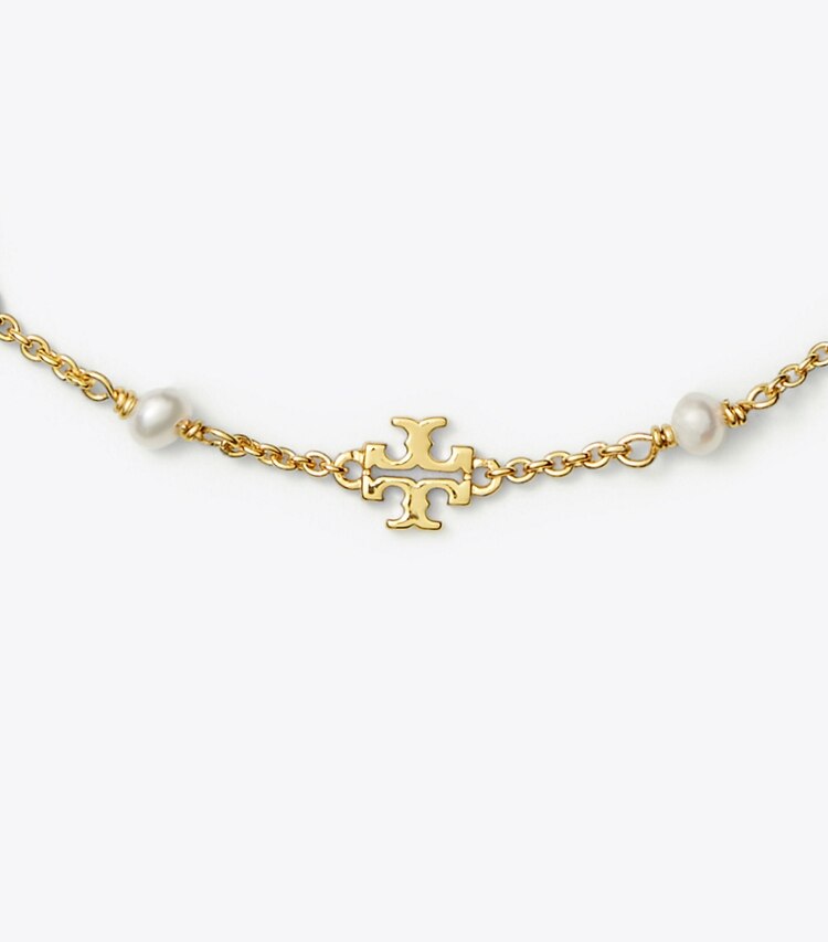Tory Burch designer bracciali Bracciale a catena con perla Kira in Tory Gold / Pearl dettaglio