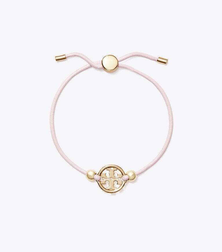 Tory Burch designer bracciali Bracciale Icon con chiusura a scorrimento in Tory Gold / Pink front