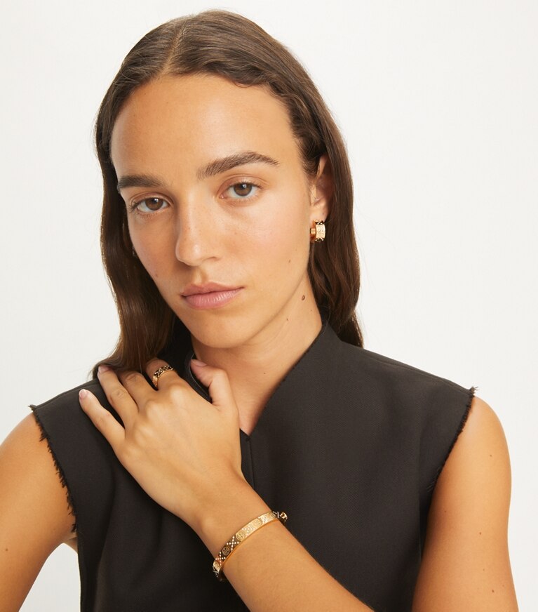 Tory Burch designer bracciali Bracciale Icon T Monogram con cerniera e pavé in Tory Gold / Crystal front