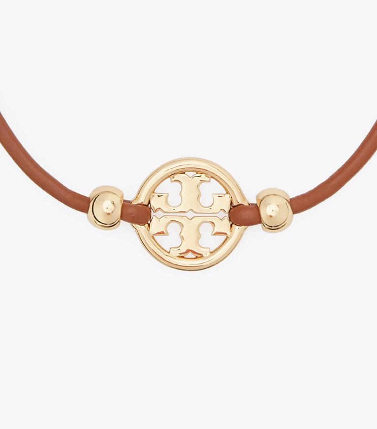 Tory Burch designer bracciali Bracciale Miller con chiusura a scorrimento in Tory Gold / Cuoio front