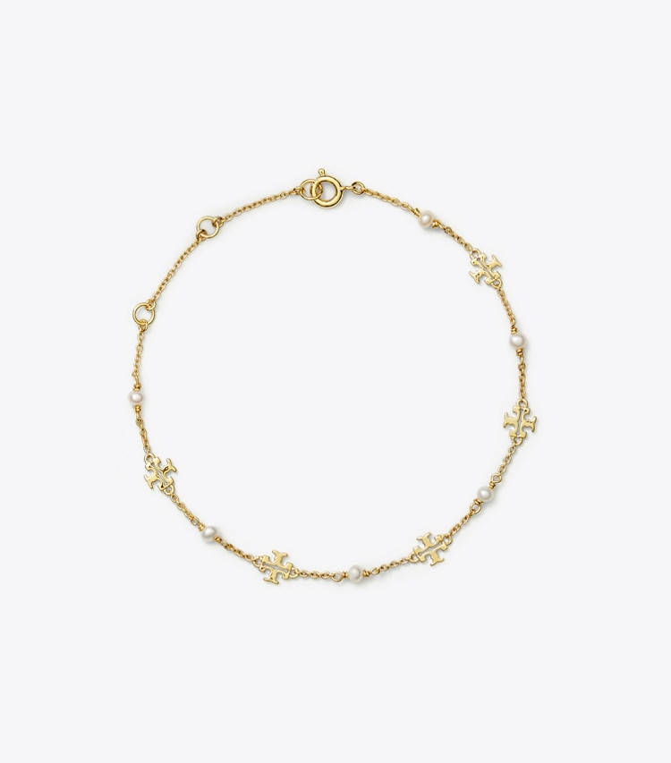 Tory Burch designer bracelets Bracelet délicat Moondance chaîne et perles in Tory Gold / Pearl front