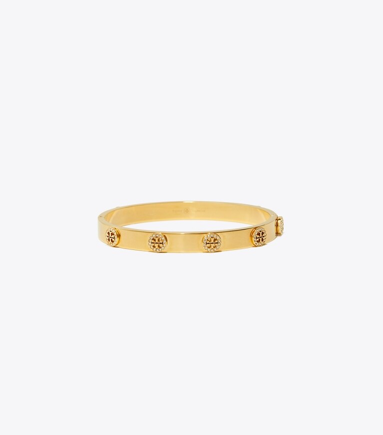 Tory Burch designer bracelets Bracelet Miller clouté à charnière pavé de cristaux in Tory Gold / Crystal front