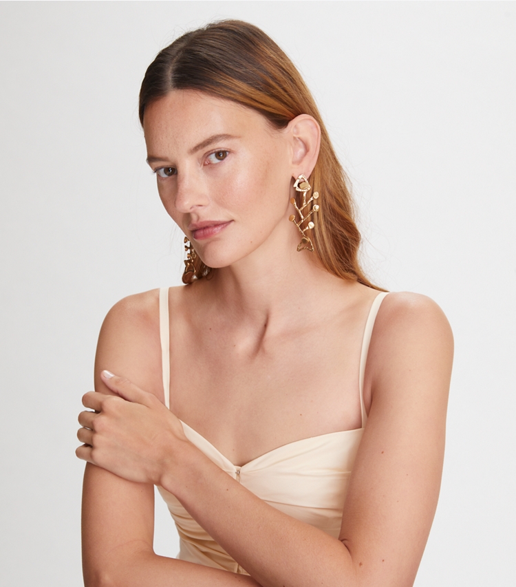 Tory Burch designer earrings Brutalist Fish Earring in Antique Light Brass accessory on model