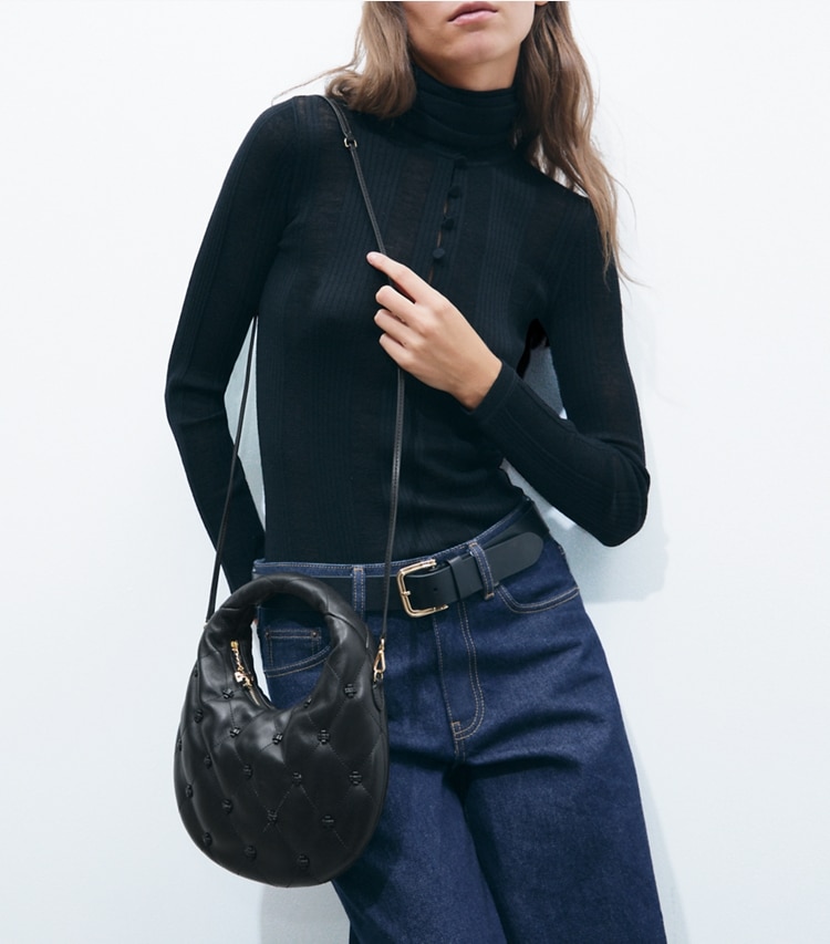 Tory Burch designer crossbody bags Bunny Knot Crescent Bag in BLACK additional on model