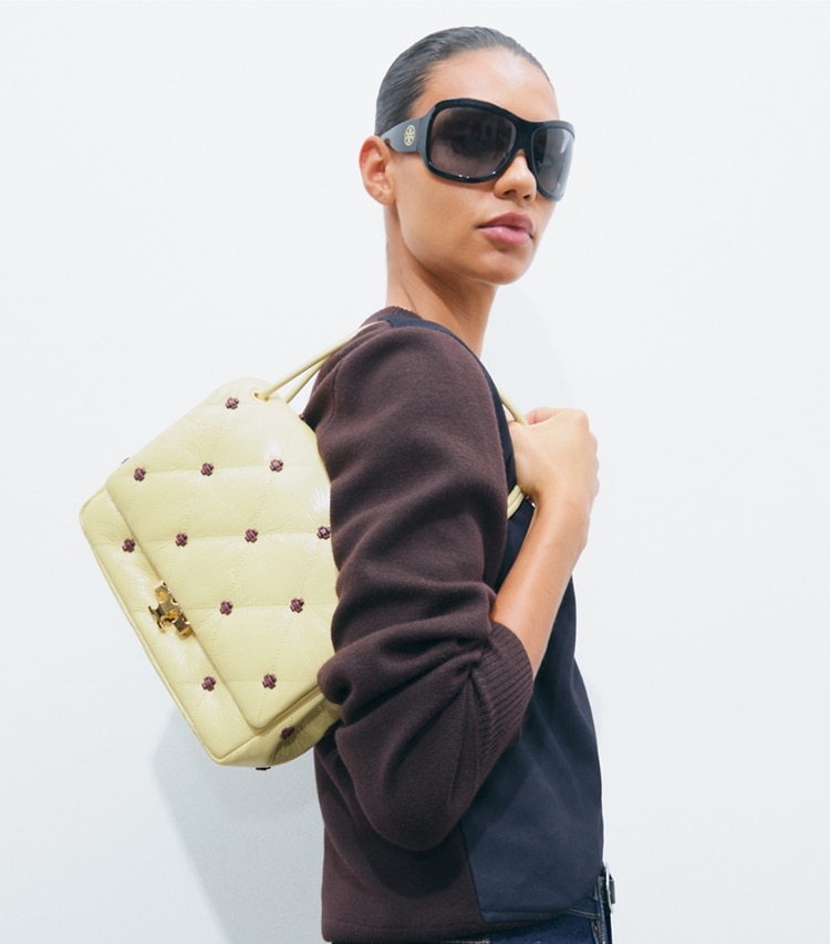 Tory Burch designer shoulder bags Bunny Knot Runway Patent Shoulder Bag in Beeswax accessory on model