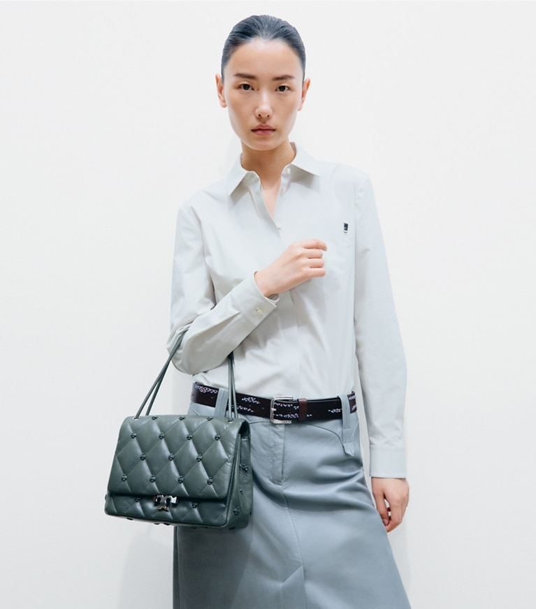 Tory Burch designer shoulder bags Bunny Knot Runway Shoulder Bag in Obsidian accessory on model