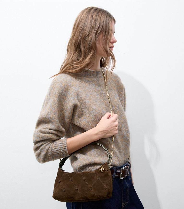 Tory Burch designer crossbody bags Bunny Knot Suede Pochette in Dark Cocoa additional on model
