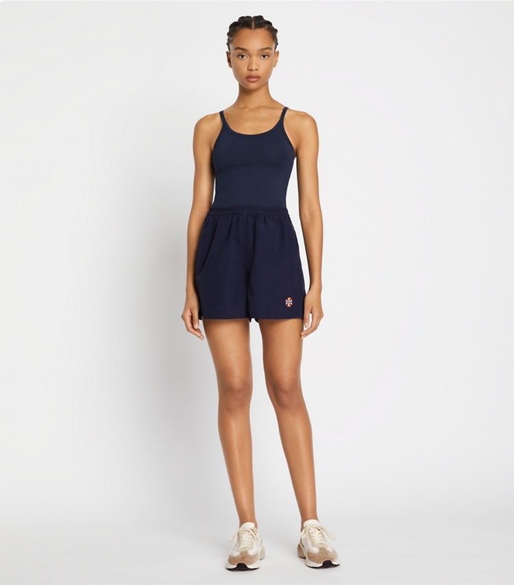 Tory Sport designer bottoms Camp Short in Tory Navy on model front