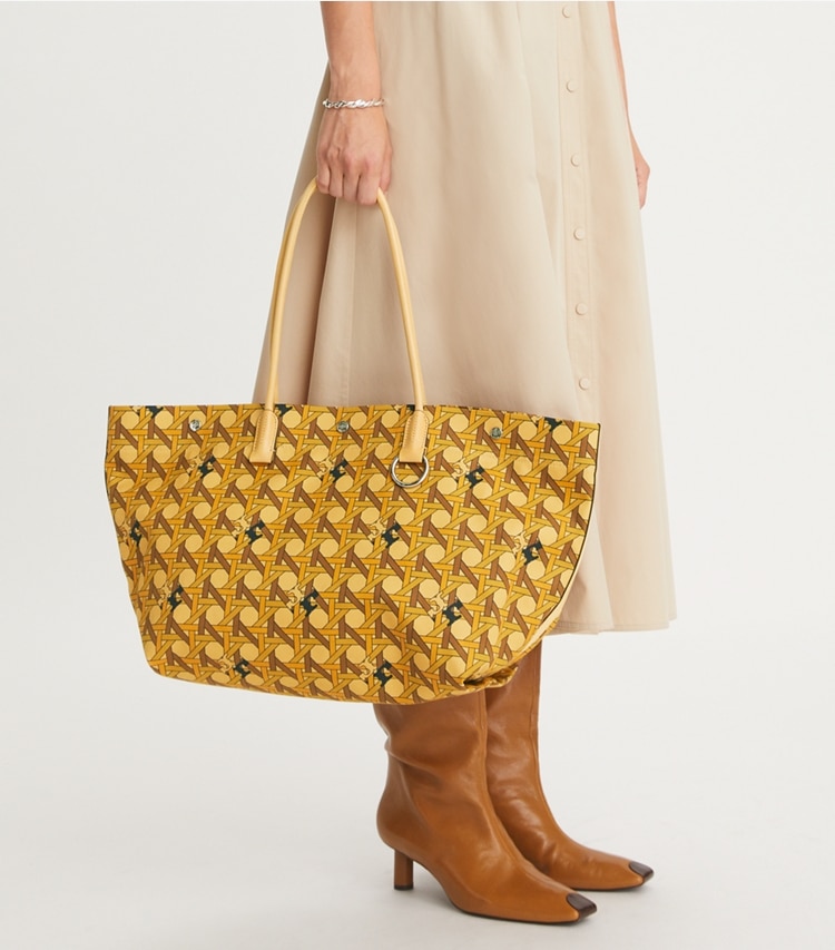 Tory Burch designer tote bags Canvas Basketweave Tote in Tan Basketweave accessory on model
