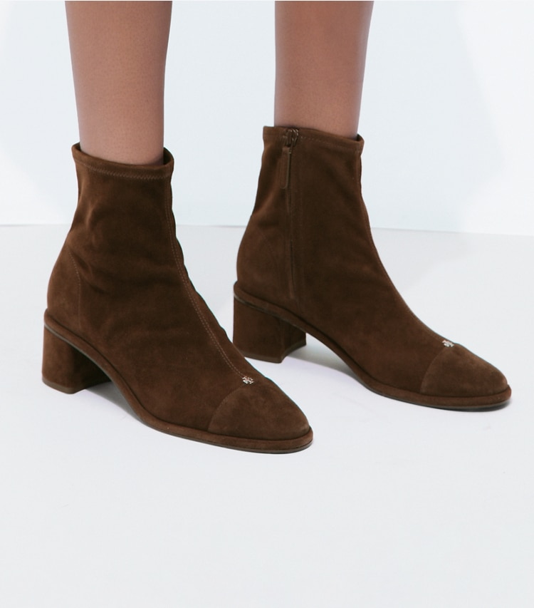 Tory Burch designer ankle boots Cap-Toe Heeled Ankle Boot in DARK COCOA / DARK COCOA accessory on model