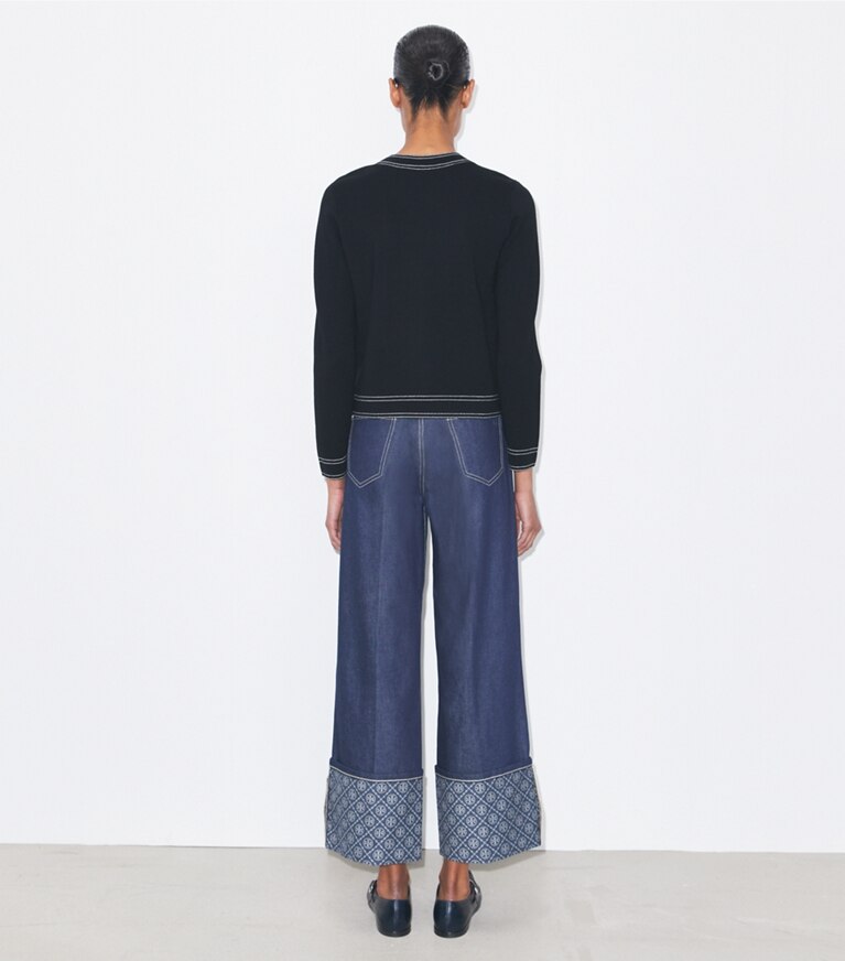 Tory Burch designer sweaters Cardigan en laine à surpiqûres dans Black sur modèle, de dos