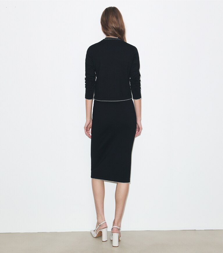 Tory Burch designer maglioni Cardigan Kendra in lana con bordi smerlati in Black / New Ivory on model back