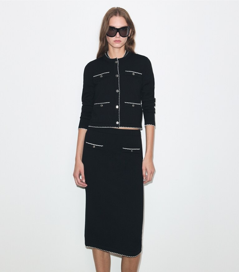 Tory Burch designer maglioni Cardigan Kendra in lana con bordi smerlati in Black / New Ivory on model detail