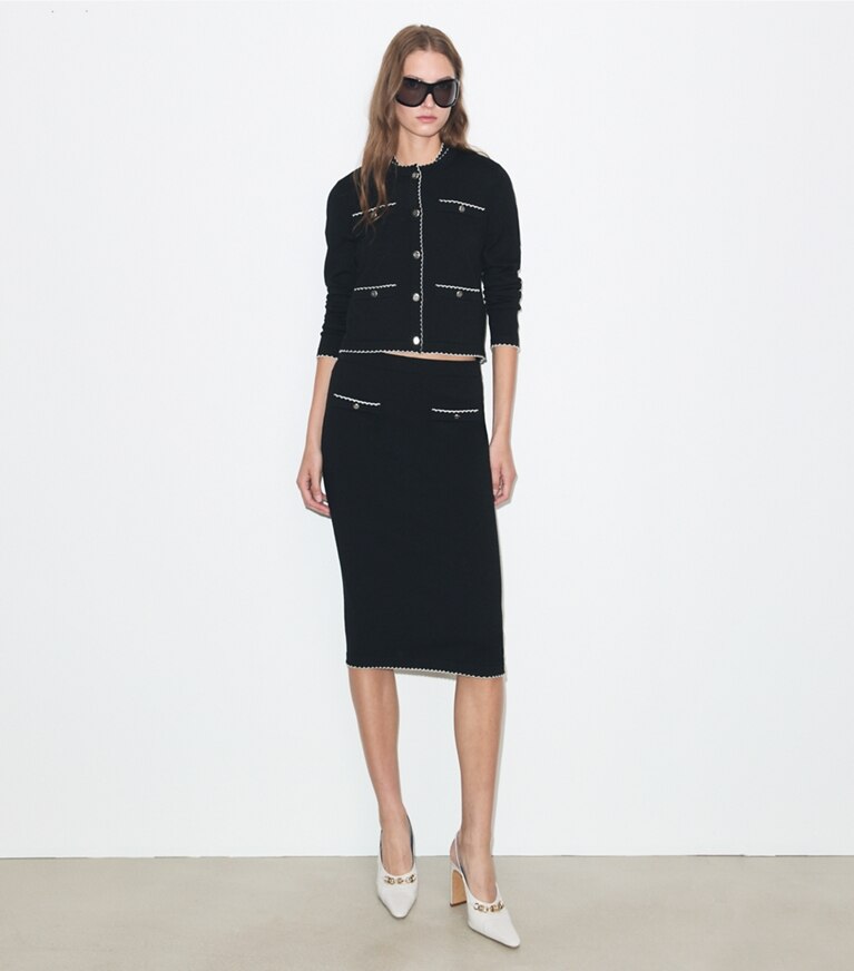 Tory Burch designer maglioni Cardigan Kendra in lana con bordi smerlati in Black / New Ivory parte anteriore su modella