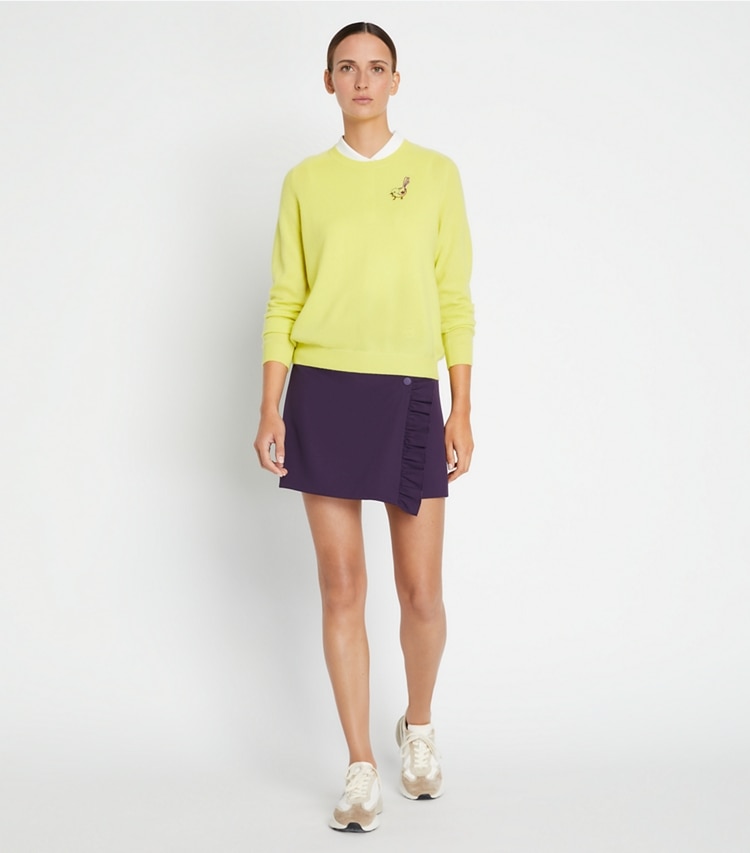 Tory Sport designer sweaters Cashmere Raglan Birdie Sweater in Lemon Glow on model front