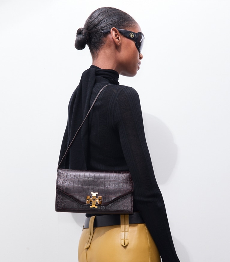 Tory Burch designer clutches Charlie Croc-Embossed Envelope Clutch in Chocolate additional on model