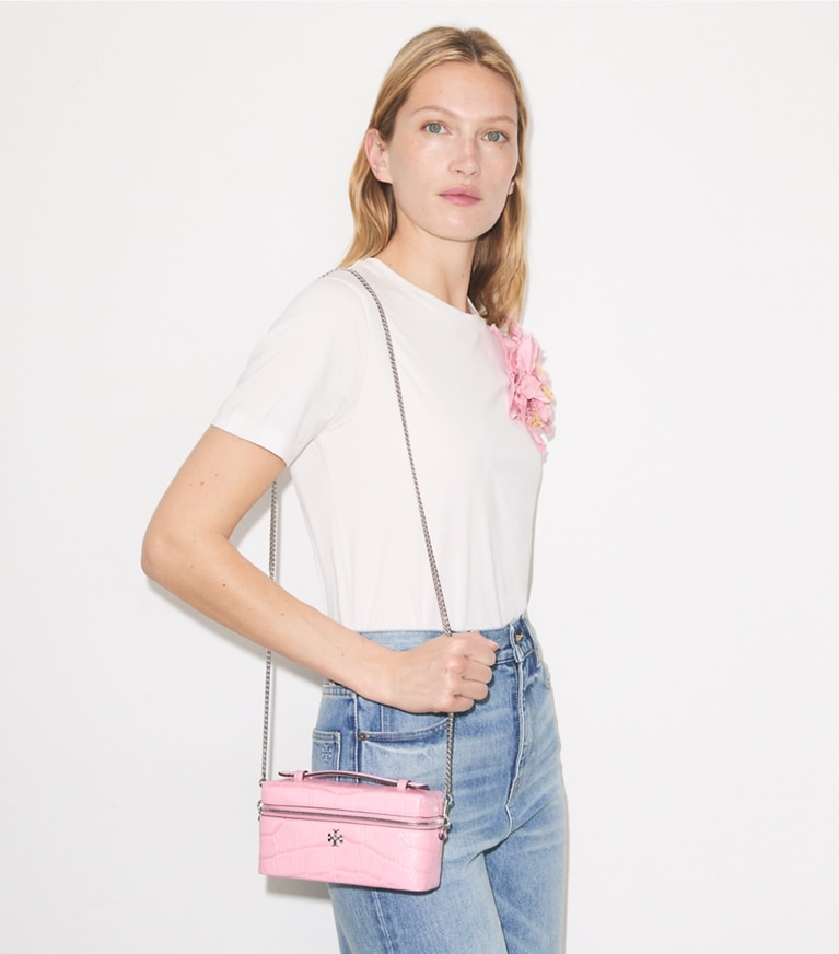 Tory Burch designer crossbody bags Charlie Croc-Embossed Vanity Case in Rose Sunset accessory on model