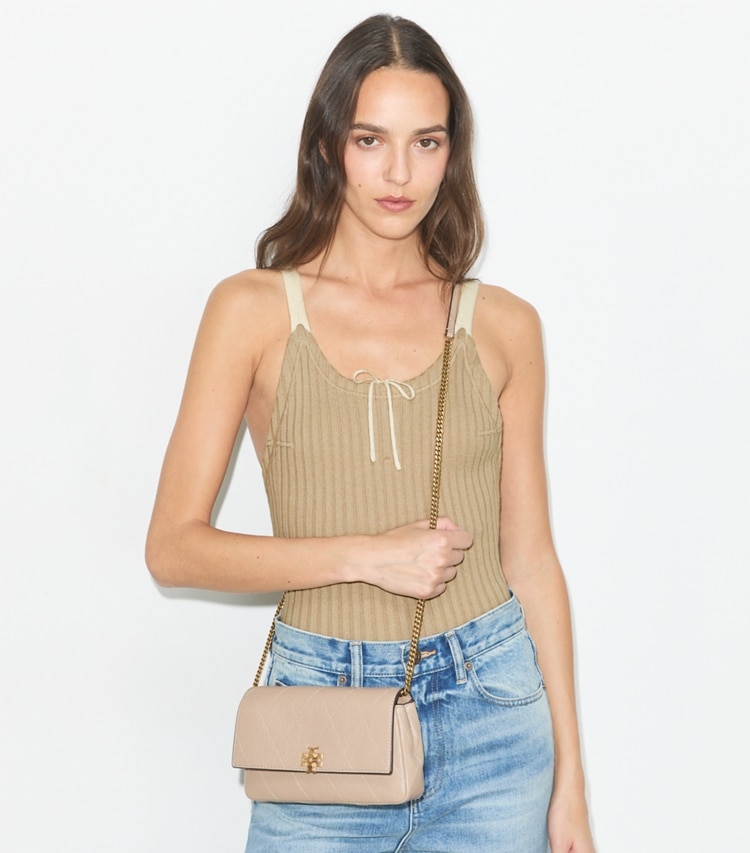 Tory Burch designer crossbody bags Charlie Quilted Chain Crossbody in Soft Cement accessory on model
