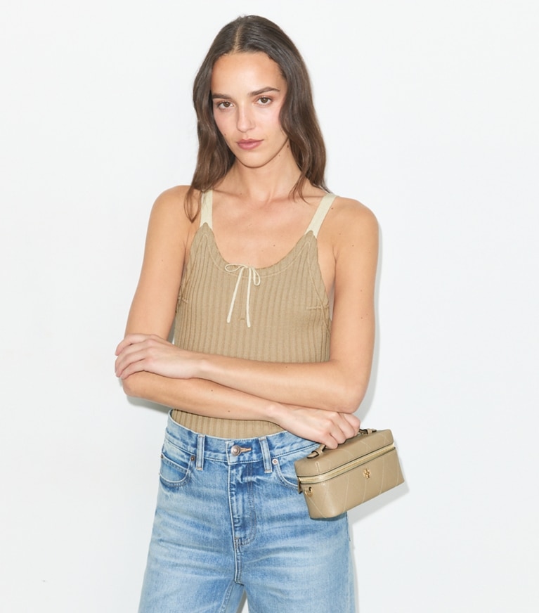 Tory Burch designer crossbody bags Charlie Quilted East-West Vanity Case in Soft Cement additional on model