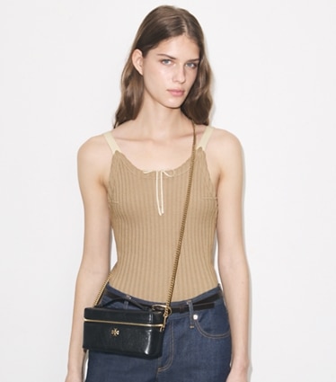 Tory Burch designer crossbody bags Charlie Quilted Vanity Case in Black accessory on model