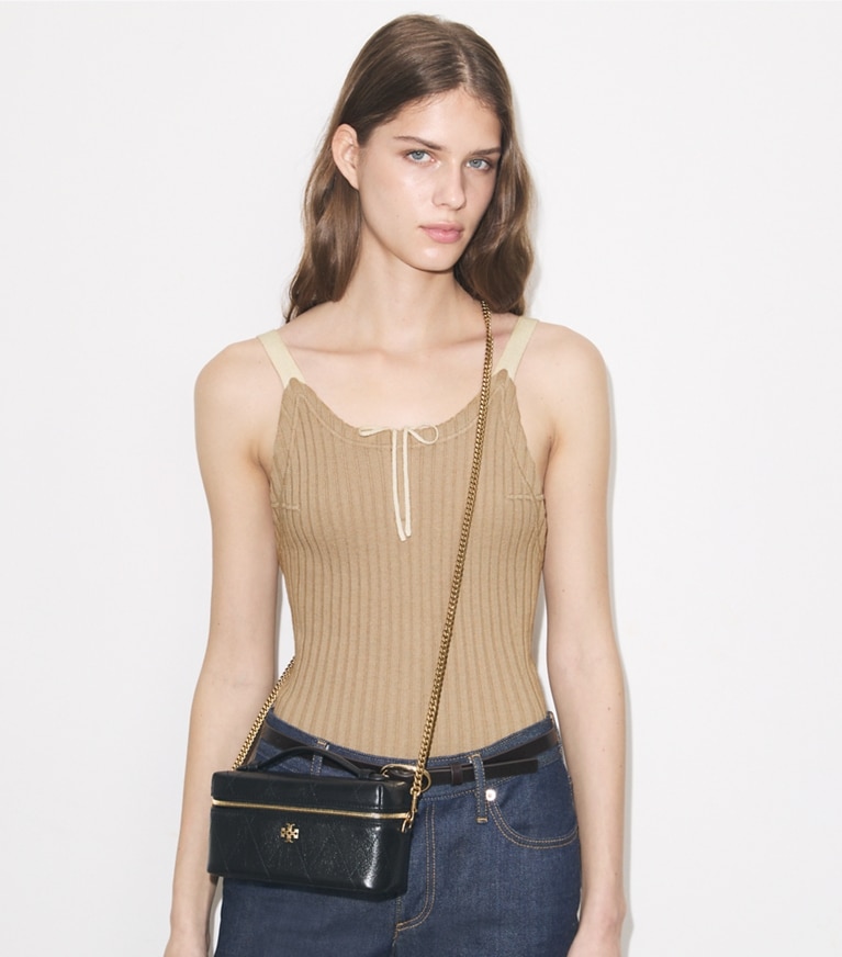 Tory Burch designer crossbody bags Charlie Quilted Vanity Case in Black accessory on model