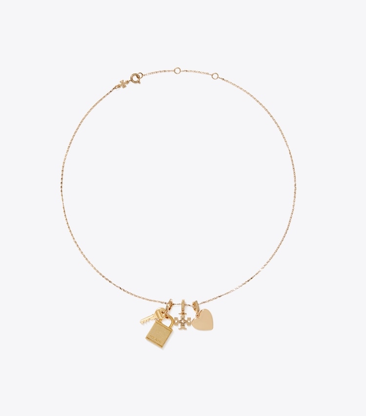 Tory Burch designer épingles à cheveux Charm cadenas et clé Curiosity in Light Brass dessus