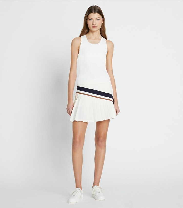 Tory Sport designer bottoms Chevron Pleated Tennis Skirt in Snow White / Anise Brown on model front