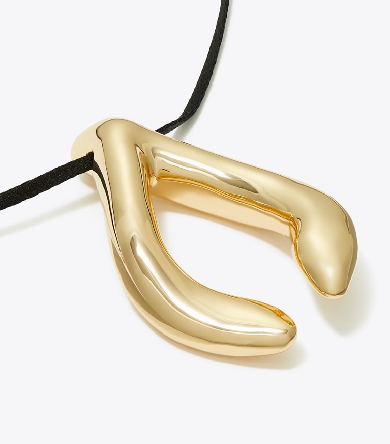 Tory Burch designer collane Ciondolo Wishbone in Light Brass / Black front