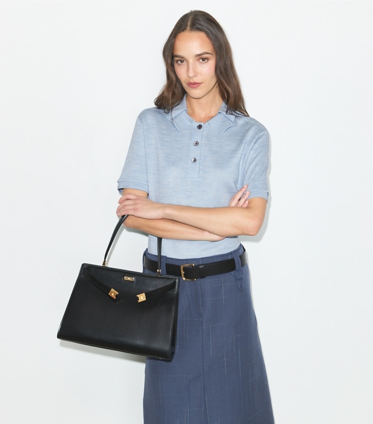 Tory Burch designer tote bags Classic Lee Radziwill Bag in Black / GOLD accessory on model